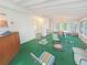 Bright sunroom with multiple windows, ceiling fan, outdoor views, and a sitting area, perfect for relaxing at 2251 Stag Run Run, Suwanee, GA 30024