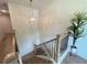 Stylish staircase with wood treads, black metal railings, and plenty of natural light at 1025 Liberty Springs Dr, Woodstock, GA 30188