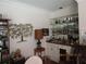 This room has a well-appointed bar area with glass shelving, ample storage, and unique decorative touches at 5523 Bahia Mar Cir, Stone Mountain, GA 30087