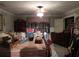 Bedroom featuring a large bed, ceiling fan and an open closet with abundant hanging space at 5523 Bahia Mar Cir, Stone Mountain, GA 30087