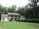 Two-story home with a covered porch, shutters, and well-maintained landscaping at 5523 Bahia Mar Cir, Stone Mountain, GA 30087