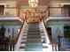 Grand foyer with a staircase, chandelier, and elegant décor at 5523 Bahia Mar Cir, Stone Mountain, GA 30087
