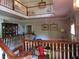 Spacious foyer featuring a second story landing with white railings and a display cabinet at 5523 Bahia Mar Cir, Stone Mountain, GA 30087