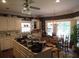 Well-appointed kitchen with an island, white cabinetry, a breakfast nook, and many windows at 5523 Bahia Mar Cir, Stone Mountain, GA 30087