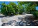 Street view of the Hampton Lofts featuring lush trees and a parking area at 10 James St # 11B, Hampton, GA 30228