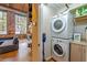 Convenient laundry area next to the kitchen featuring stacked washer and dryer at 10 James St # 11B, Hampton, GA 30228