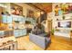 Open-concept living space featuring spiral staircase, modern kitchen, exposed brick, and eclectic decor at 10 James St # 11B, Hampton, GA 30228