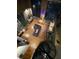 Open floorplan featuring exposed brick, modern kitchen, eclectic art, and spiral staircase at 10 James St # 11B, Hampton, GA 30228