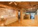 Large main bedroom with exposed brick wall, wood floors, barn door, and natural light at 10 James St # 11B, Hampton, GA 30228