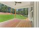 A serene back porch overlooks a lush green lawn at 1005 Liberty Springs Dr, Woodstock, GA 30188
