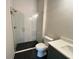 Modern bathroom featuring a glass shower with black tile floor and white subway tile walls at 1005 Liberty Springs Dr, Woodstock, GA 30188