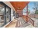 Cozy back porch with wood plank ceiling and hanging egg chair offers a tranquil outdoor space at 1740 S Gordon Sw St, Atlanta, GA 30310