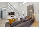 Bright living room with a soaring ceiling, comfortable seating, modern design, and natural light at 1740 S Gordon Sw St, Atlanta, GA 30310