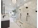 An oversized glass shower with marble walls and dual shower heads adds luxury to the main bathroom at 1740 S Gordon Sw St, Atlanta, GA 30310
