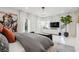 Spacious main bedroom with white tile floors, a modern light fixture and a striking painting of an elephant at 1740 S Gordon Sw St, Atlanta, GA 30310