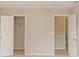 This bedroom provides lots of closet space with doors leading to the interior at 180 Jay Trl, Fayetteville, GA 30215