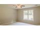 A sunlit bedroom with large window enhances the natural light on carpeted floors at 180 Jay Trl, Fayetteville, GA 30215