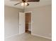 Neutral bedroom features a ceiling fan and beige walls, perfect for relaxation at 180 Jay Trl, Fayetteville, GA 30215