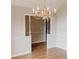 Dining room with hardwood floors and chandelier lighting at 180 Jay Trl, Fayetteville, GA 30215