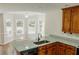 Kitchen with granite countertops, stainless sink, and eat-in breakfast nook at 180 Jay Trl, Fayetteville, GA 30215