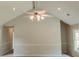 Spacious living room with high ceilings, a decorative ceiling fan, and ample natural light at 180 Jay Trl, Fayetteville, GA 30215