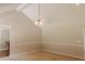Bright, open living room with neutral walls, white trim, and stylish ceiling fan fixture at 180 Jay Trl, Fayetteville, GA 30215