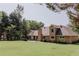 Expansive backyard with a brick house, perfect for outdoor activities and entertaining at 180 Jay Trl, Fayetteville, GA 30215