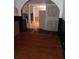 A basement area is showcased with hardwood floors, stone fireplace, and an open concept at 3072 Will Rogers Se Pl, Atlanta, GA 30316