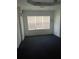 Empty bedroom featuring a textured brick wall, carpeted floors, and natural light at 3072 Will Rogers Se Pl, Atlanta, GA 30316