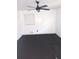 The bedroom is showcased with white walls, vinyl floors, natural light, and a ceiling fan at 3072 Will Rogers Se Pl, Atlanta, GA 30316