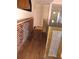 A cozy living area is shown with hardwood floors and a brick accent wall with a granite bar at 3072 Will Rogers Se Pl, Atlanta, GA 30316