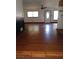 A spacious living room boasts hardwood floors, lots of natural light, and a ceiling fan at 3072 Will Rogers Se Pl, Atlanta, GA 30316