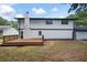 Well-maintained backyard featuring a spacious deck and a home with dark trim at 464 Rockborough Ter, Stone Mountain, GA 30083