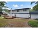 Backyard featuring a deck, partial shade, and well-maintained white exterior at 464 Rockborough Ter, Stone Mountain, GA 30083