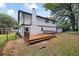 Expansive backyard deck enhances the appeal of this two-story white home at 464 Rockborough Ter, Stone Mountain, GA 30083