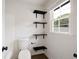 Bathroom featuring floating shelves and wood-look flooring at 464 Rockborough Ter, Stone Mountain, GA 30083