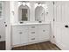 Bathroom featuring dual sink with white cabinets and modern black hardware at 464 Rockborough Ter, Stone Mountain, GA 30083