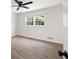 Bright bedroom features wood-look floors and a ceiling fan at 464 Rockborough Ter, Stone Mountain, GA 30083