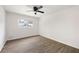Bedroom with a ceiling fan, window and wood-look flooring at 464 Rockborough Ter, Stone Mountain, GA 30083