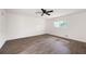 Bedroom with a ceiling fan, window and wood-look flooring at 464 Rockborough Ter, Stone Mountain, GA 30083