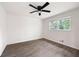Bedroom with a ceiling fan, window and wood-look flooring at 464 Rockborough Ter, Stone Mountain, GA 30083