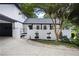 Attractive home featuring a white brick fence, black trim, and mature trees at 464 Rockborough Ter, Stone Mountain, GA 30083