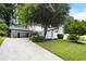 Lovely home with well-maintained lawn, mature trees, and a two car garage at 464 Rockborough Ter, Stone Mountain, GA 30083