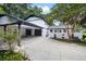 Beautiful two-story home with a white brick fence, two car garage and mature trees at 464 Rockborough Ter, Stone Mountain, GA 30083
