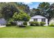 Nice home with a well-manicured lawn and mature trees at 464 Rockborough Ter, Stone Mountain, GA 30083
