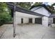 Spacious garage with a covered carport and convenient side door access at 464 Rockborough Ter, Stone Mountain, GA 30083