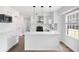 Modern kitchen with white cabinets, stainless steel appliances, and a large island at 464 Rockborough Ter, Stone Mountain, GA 30083