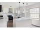 Kitchen with white cabinets, stainless steel appliances, and center island at 464 Rockborough Ter, Stone Mountain, GA 30083