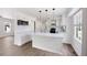 Bright kitchen with white cabinets, stainless appliances and center island at 464 Rockborough Ter, Stone Mountain, GA 30083