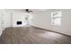 Spacious living room with a brick fireplace and wood flooring at 464 Rockborough Ter, Stone Mountain, GA 30083